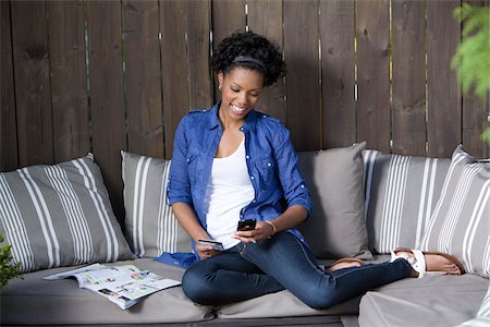 patio furniture - Woman Making Purchase with Cell Phone Stock Photo - Rights-Managed, Code: 700-05389240