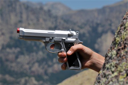 disparo - Man Pointing Gun, Aiguilles de Bavella, Corsica, France Foto de stock - Con derechos protegidos, Código: 700-05389509