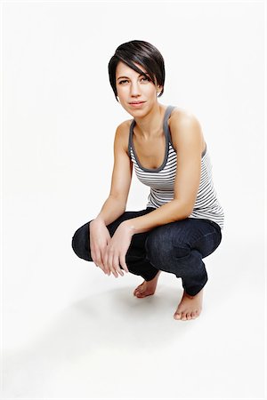 squatting women - Portrait of Woman in Studio Stock Photo - Rights-Managed, Code: 700-05451022