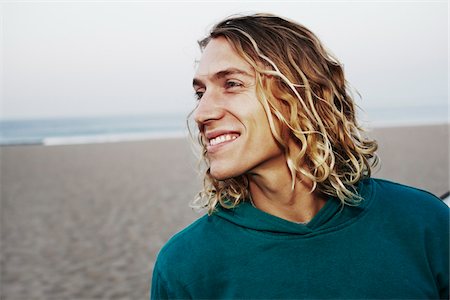 face close up young man looking sideways - Close-Up of Man on Beach Stock Photo - Rights-Managed, Code: 700-05451046