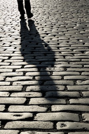 england outdoors one person - Shadow of Person on Cobblestones, London, England Stock Photo - Rights-Managed, Code: 700-05524561