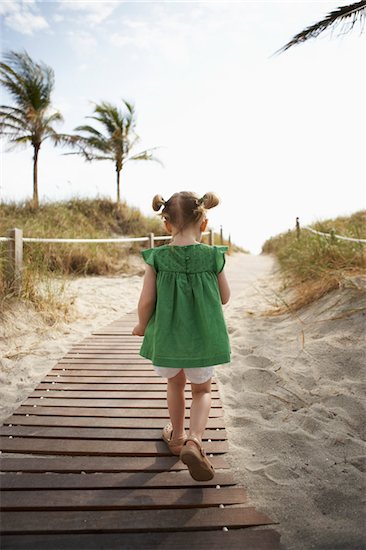 Little Girl Walking on Beach Boardwalk Stock Photo - Premium Rights-Managed, Artist: Michael Alberstat, Image code: 700-05560266
