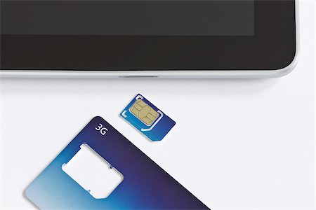 Carte Micro-SIM 3 G et iPad Tablet PC Photographie de stock - Rights-Managed, Code: 700-05641559