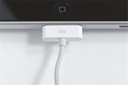 USB Cable Plugged into iPad Tablet Computer Fotografie stock - Rights-Managed, Codice: 700-05641561