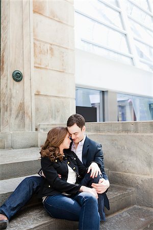 person rubbing nose - Couple Sitting on Stairs Stock Photo - Rights-Managed, Code: 700-05641793