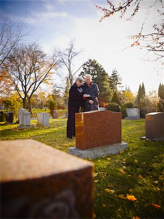 Couple Grieving in Cemetery Stock Photo - Rights-Managed, Code: 700-05656529
