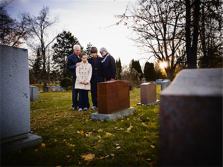 senior couple kids - Family Grieving in Cemetery Stock Photo - Rights-Managed, Code: 700-05656533