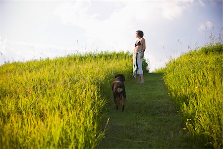 Woman and Dog Outdoors Foto de stock - Con derechos protegidos, Código: 700-05653188