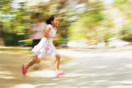 Girl Running Outdoors, Bangkok, Thailand Stock Photo - Rights-Managed, Code: 700-05756222