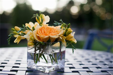 flower vase for tables - Flowers in Vase on Outdoor Table Stock Photo - Rights-Managed, Code: 700-05803341