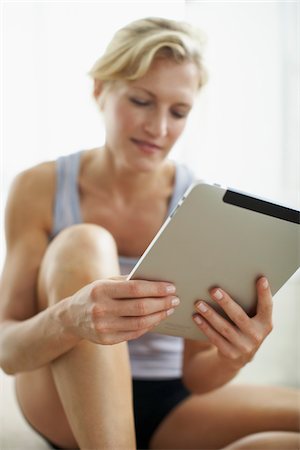 exercising indoors one - Woman Holding iPad Stock Photo - Rights-Managed, Code: 700-05803448