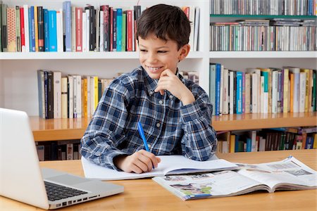 Boy Doing Homework Foto de stock - Con derechos protegidos, Código: 700-05803527