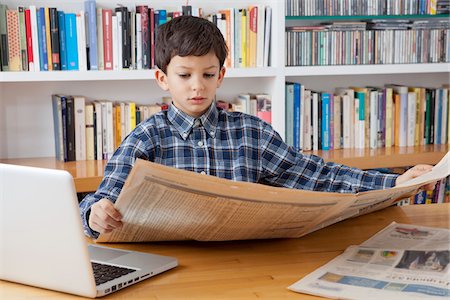 reading books with kids - Boy Reading Newspaper Stock Photo - Rights-Managed, Code: 700-05803529