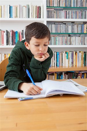 Boy Doing Homework Foto de stock - Con derechos protegidos, Código: 700-05803520