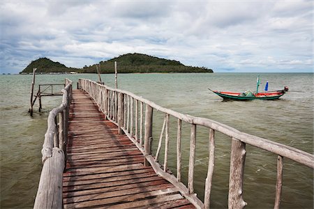 Wooden Dock and Phitak Island, Lung Suan, Chumporn, Thailand Stock Photo - Rights-Managed, Code: 700-05803546