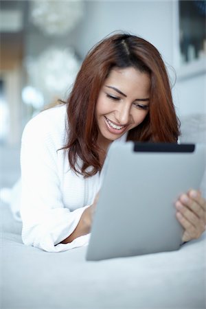 females only bed lying - Woman with Tablet Computer Stock Photo - Rights-Managed, Code: 700-05821905