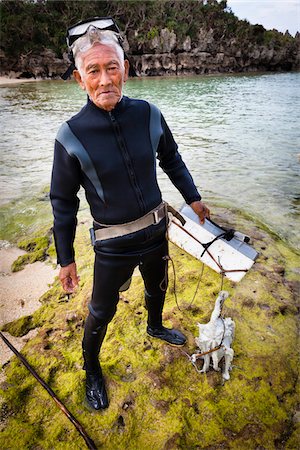 Homme avec Octopus, Tokei Beach, île de Kouri, Okinawa, Japon Photographie de stock - Rights-Managed, Code: 700-05837427