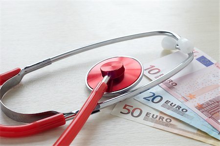 simsearch:600-06701754,k - Still Life of Stethoscope and Money Stock Photo - Rights-Managed, Code: 700-05948050
