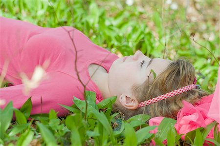 european 14 year old girl - Teenage Girl Lying on Ground Stock Photo - Rights-Managed, Code: 700-05973476