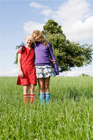 Portrait of Two Girls Standing in Field Stock Photo - Rights-Managed, Code: 700-05973516