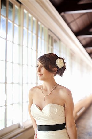 strapless wedding gown - Bride Looking Out Window Stock Photo - Rights-Managed, Code: 700-05973632