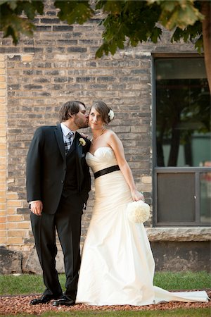 dinner jacket - Groom Kissing Bride on Cheek Stock Photo - Rights-Managed, Code: 700-05973646