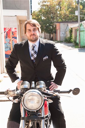 simsearch:700-05781015,k - Man Wearing Suit Sitting on Motorcycle Stock Photo - Rights-Managed, Code: 700-05973653