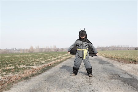 Boy Wearing Superhero Costume Foto de stock - Con derechos protegidos, Código: 700-05973888