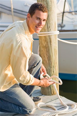 ropa casual - Man Tying Boat to Dock Stock Photo - Rights-Managed, Code: 700-06009204