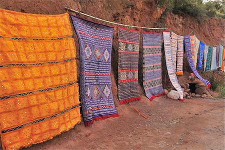 dirt roads in africa - Berber Carpet Lining Road, Ourika Valley, Atlas Mountains, Morocco Stock Photo - Rights-Managed, Code: 700-06038012