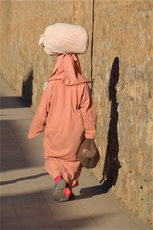 peach color - Person Carrying Load on Head, Marrakech, Morocco Stock Photo - Rights-Managed, Code: 700-06038056
