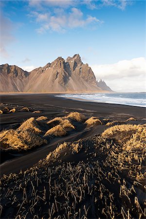 Plage volcanique et montagnes, Hofn j'ai Hornafiroi, Islande Photographie de stock - Rights-Managed, Code: 700-06059826