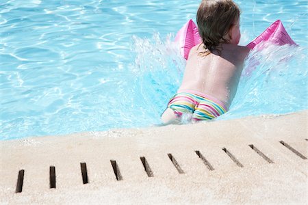 female floatation device - Little Girl in Swimming Pool Stock Photo - Rights-Managed, Code: 700-06119646