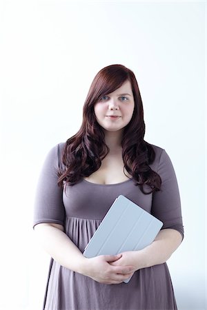 plus size woman - Portrait of Woman Holding iPad Stock Photo - Rights-Managed, Code: 700-06144777