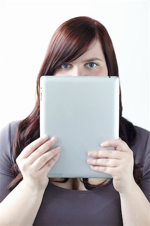 Woman Holding iPad in front of Face Foto de stock - Con derechos protegidos, Código: 700-06144780