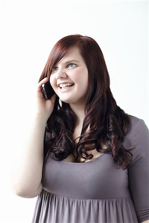 dress for fat women - Happy Woman Using iPhone Stock Photo - Rights-Managed, Code: 700-06144783