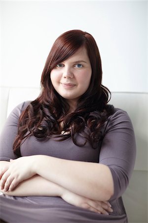 fat woman arms folded - Portrait of Woman Sitting Stock Photo - Rights-Managed, Code: 700-06144792