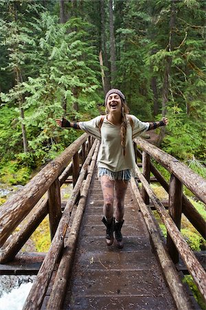 simsearch:700-06190650,k - Young Woman with Open Arms Crossing Bridge Stock Photo - Rights-Managed, Code: 700-06190624