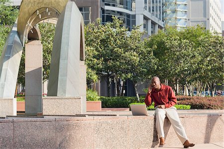 sculptures in the courtyards - Businessman with Laptop and Cell Phone Stock Photo - Rights-Managed, Code: 700-06282135