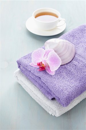 spa towel - Cup of Tea and Stack of Towels with Seashell and Orchid Stock Photo - Rights-Managed, Code: 700-06302285