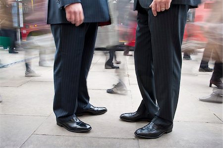 sidewalk blur - Two Businessmen Standing Amongst Pedestrian Traffic Stock Photo - Rights-Managed, Code: 700-06325341