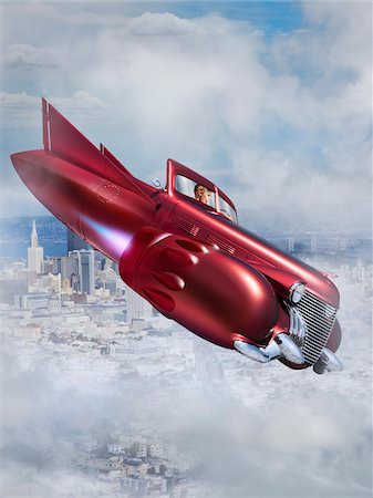 Woman Flying Jet Car over City Stock Photo - Rights-Managed, Code: 700-06368057