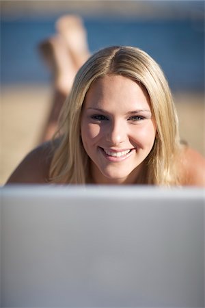 Teenage Girl with Laptop on Beach Stock Photo - Rights-Managed, Code: 700-06383756