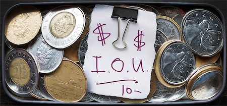 simsearch:600-06701754,k - IOU Note in Tin of Loose Change Stock Photo - Rights-Managed, Code: 700-06383841