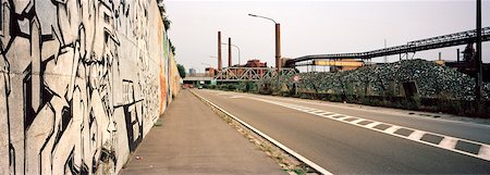 Graffiti Covered Walls along Road by Glass Recycling Plant in Industrial Area, Charleroi, Walloon, Province of Hainaut, Belgium Stock Photo - Rights-Managed, Code: 700-06407773