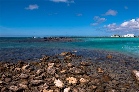 simsearch:700-06439062,k - Rocky Shoreline with Blue Sky and Clouds, Baby Beach, Seroe Colorado, Aruba, Lesser Antilles, Dutch Antilles Stock Photo - Rights-Managed, Code: 700-06439074