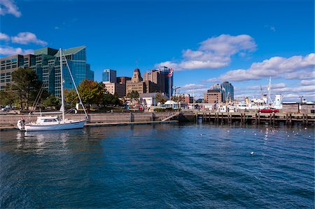 Sailboat in Harbor with View of City, Halifax, Nova Scotia, Canada Photographie de stock - Rights-Managed, Code: 700-06439176