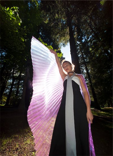 Girl with Outstretched Fairy Wings with Sun Shining from Behind Stock Photo - Premium Rights-Managed, Artist: Mark Downey, Image code: 700-06431494