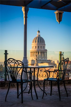 Bistro Table and Chairs on Rooptop of Hotel Parque Central with El Capitolio, Old Havana, Havana, Cuba Photographie de stock - Rights-Managed, Code: 700-06465883