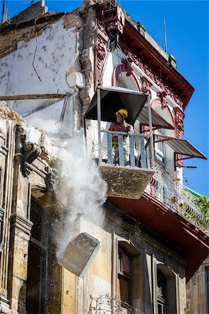 Construction Worker Standing in Elevated Word Platform During Building Demolition, Havana, Cuba Stock Photo - Rights-Managed, Code: 700-06465906